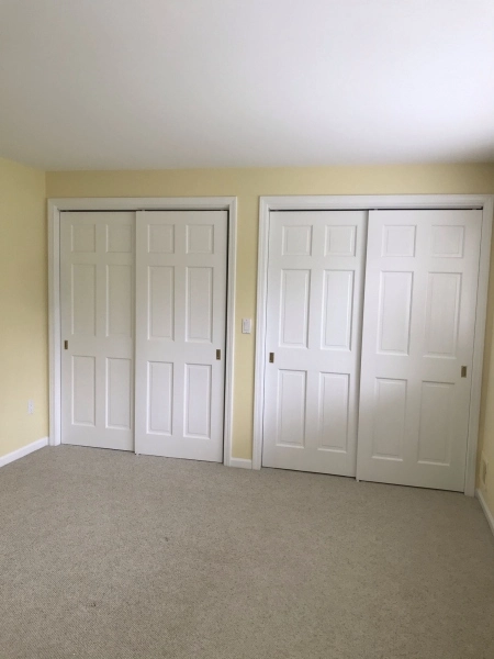 The interior of an Ann Arbour residence. We painted the bedroom a Sherwin Williams eggshell yellow with white gloss trim and white closet doors.