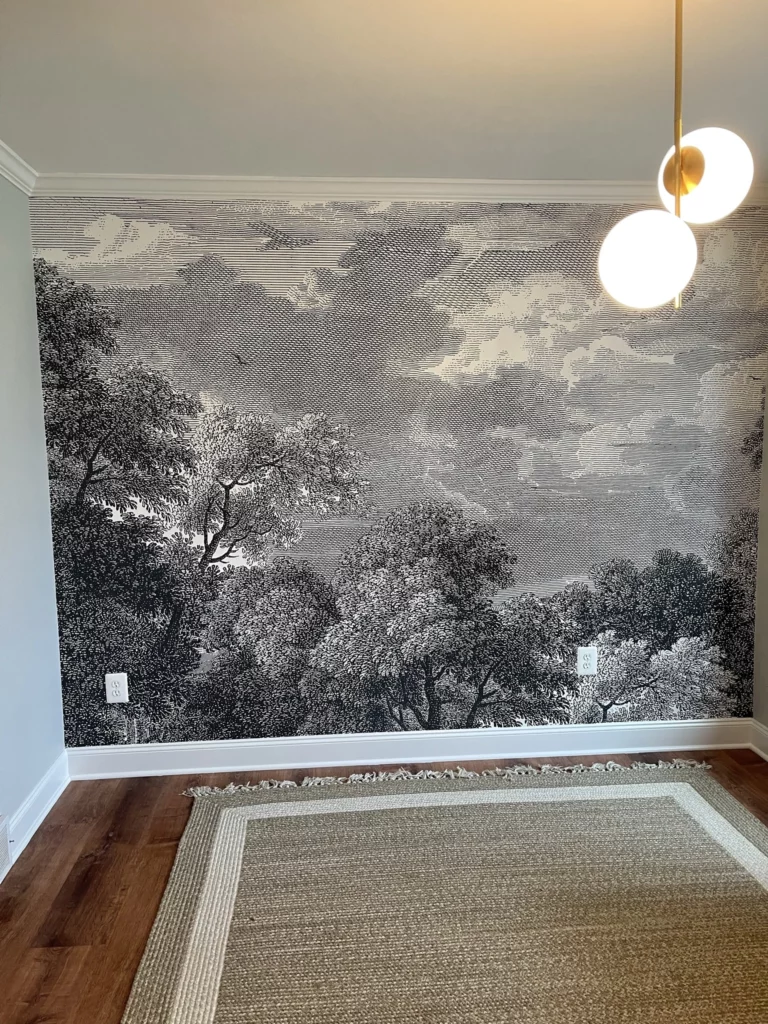 black and white wall paper mural in a dining room